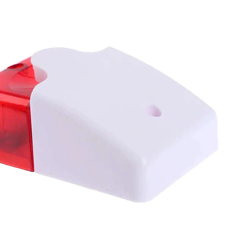120 dB LED strobe light with red lens in white plastic housing