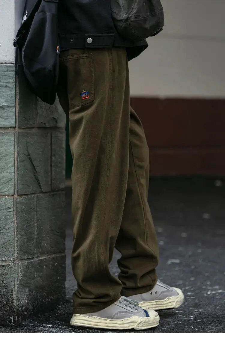 Olive cargo pants for men with small embroidered logo patch from Simples Market