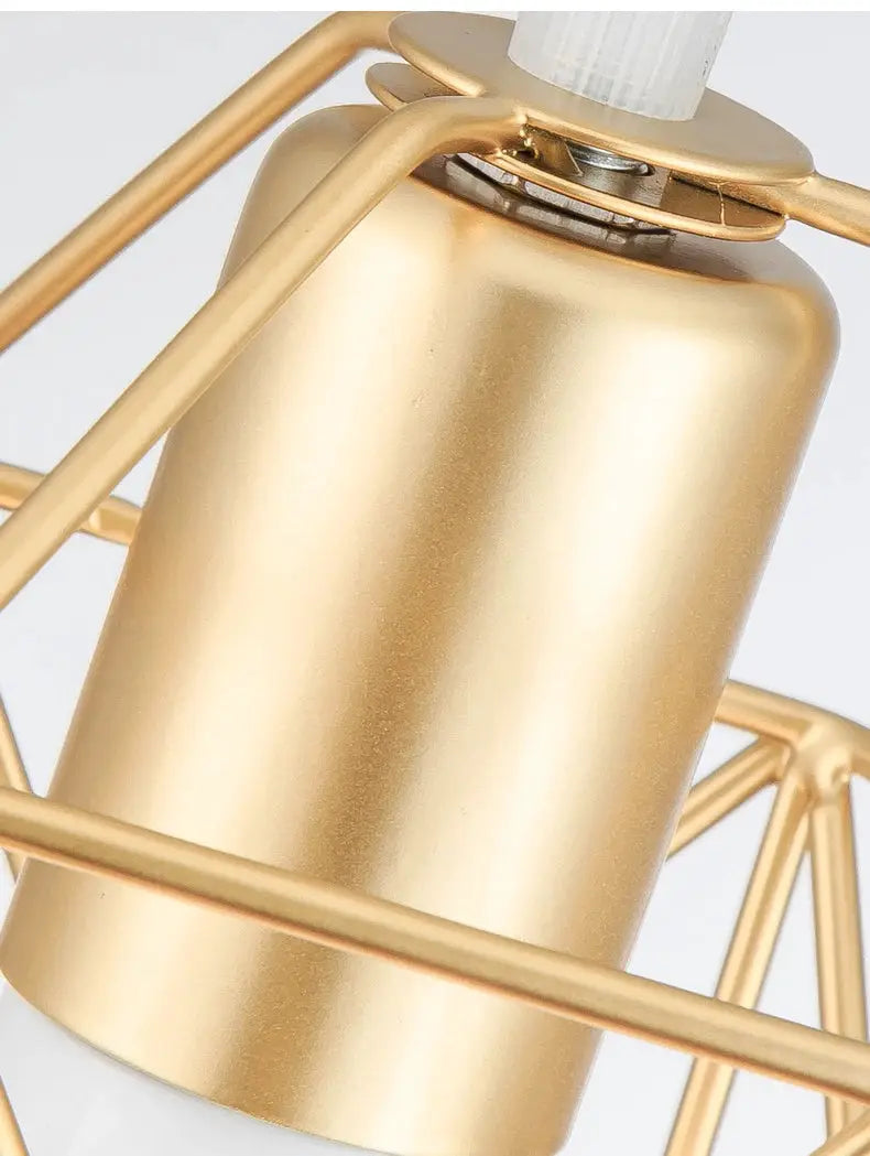 Modern LED pendant light with a gold-tone metal cylinder inside a geometric cage.