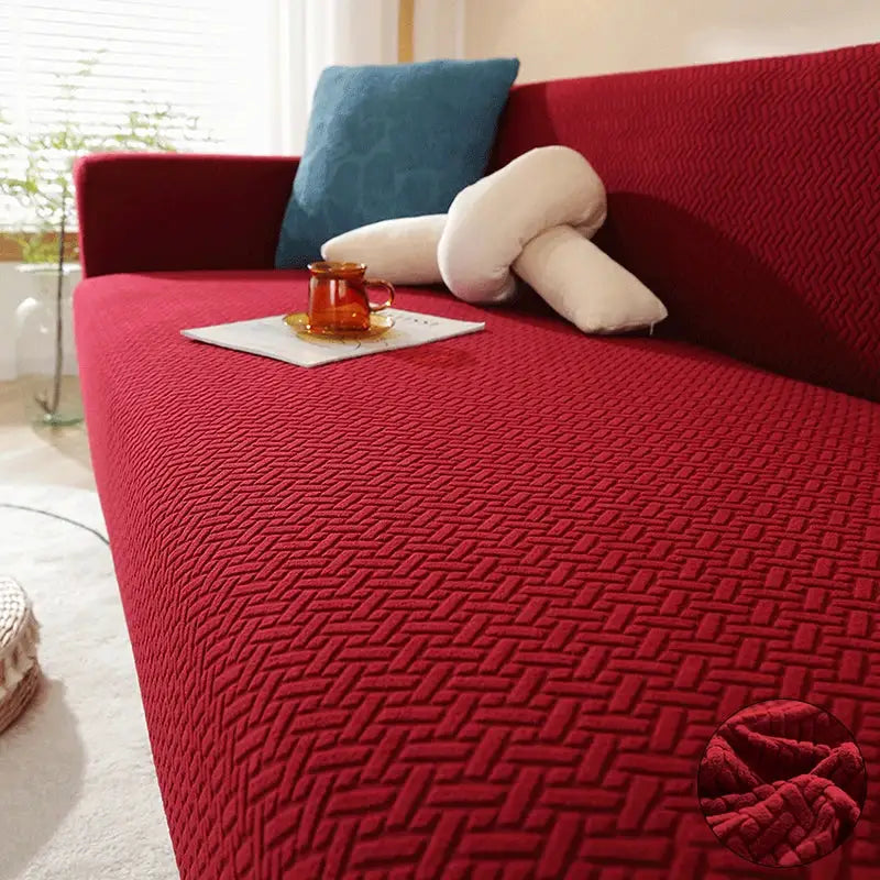 Jacquard elastic sofa cover by Simples Market in red polar fleece for L-shaped 1–4 seater sofa, with blue cushion.