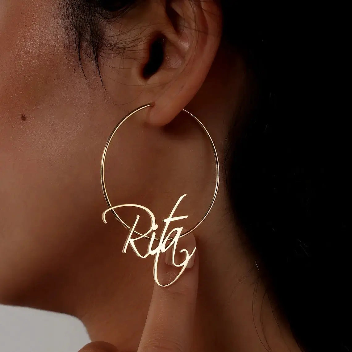 Custom name 70mm hoop earring in gold-tone stainless steel with Rita script name pendant