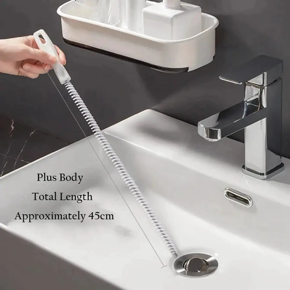 Drain cleaning brush with long white flexible coil for bathroom sink clogs, approximately 45 cm