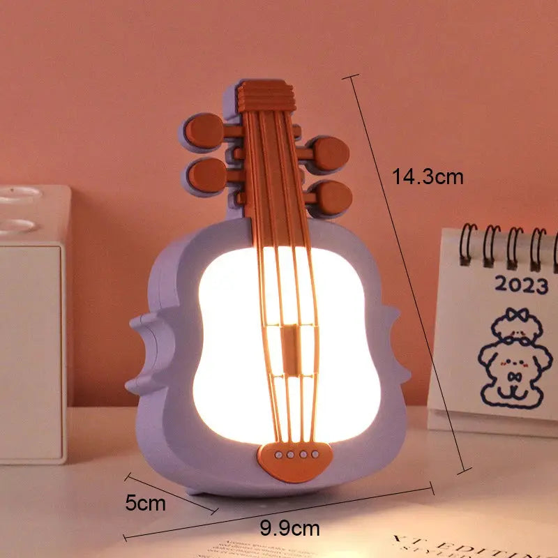Simples Market guitar-shaped LED night light in lavender with orange neck, warm white glow, mini desktop lamp