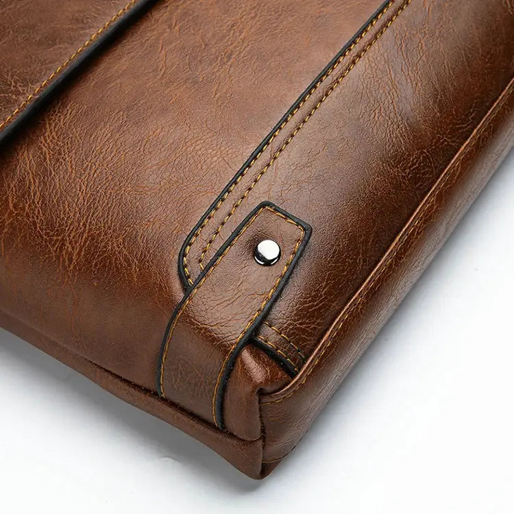 Shoulder bag, brown leather, men's crossbody style with metal snap closure