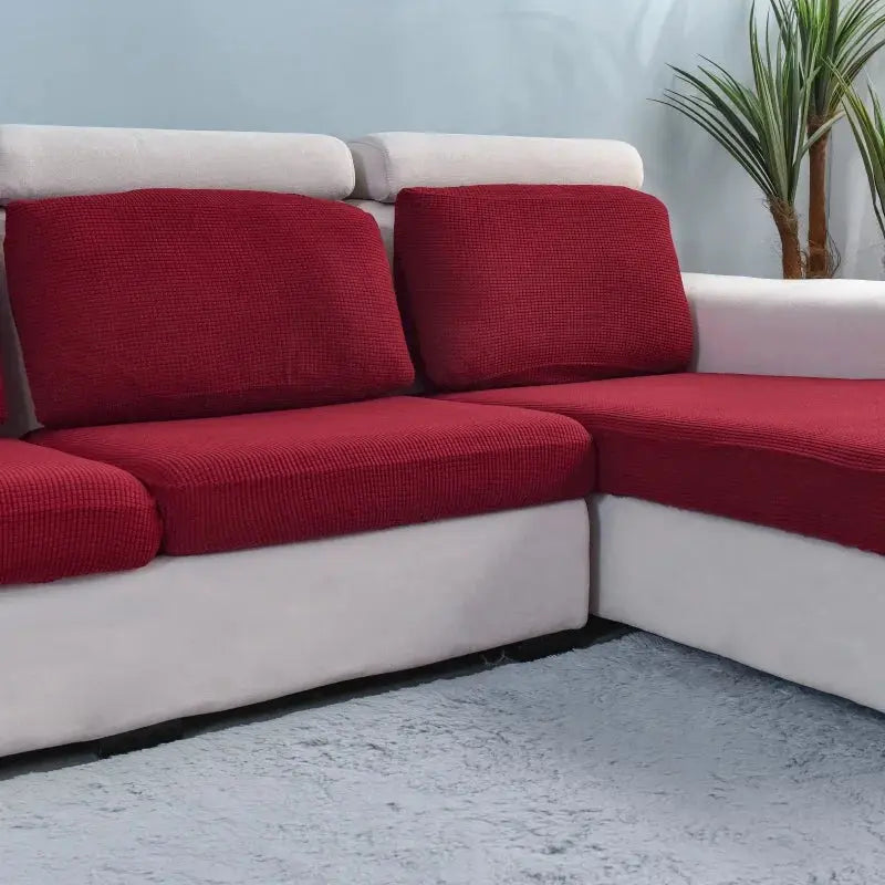 Simples Market thick elastic sofa cover in solid red for L-shaped sectional; textured cushions on a beige sofa