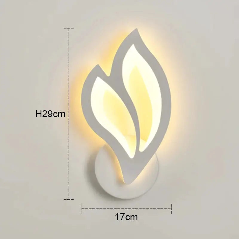 Simples Market modern LED wall lamp, leaf-shaped design with warm backlit glow, 29 cm high by 17 cm wide