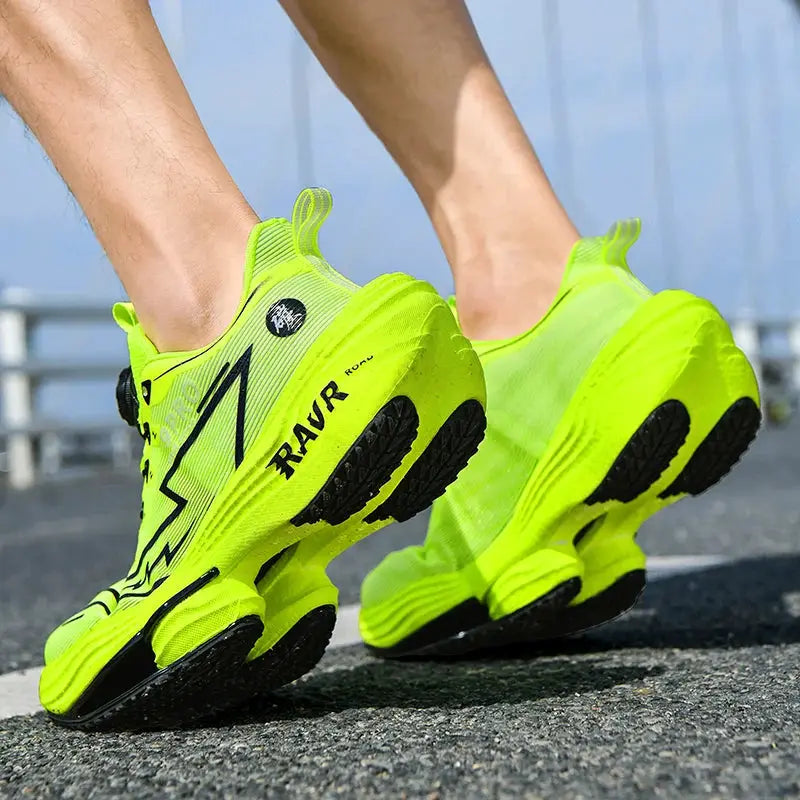 Pair of men's neon yellow running shoes with black outsole grip