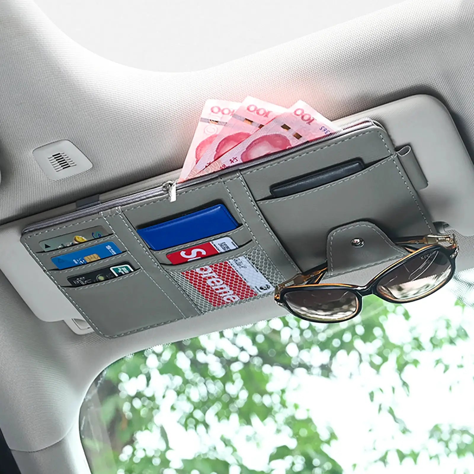 Gray car sun visor organizer with card slots, cash pocket, zipper pouch, and sunglasses clip.