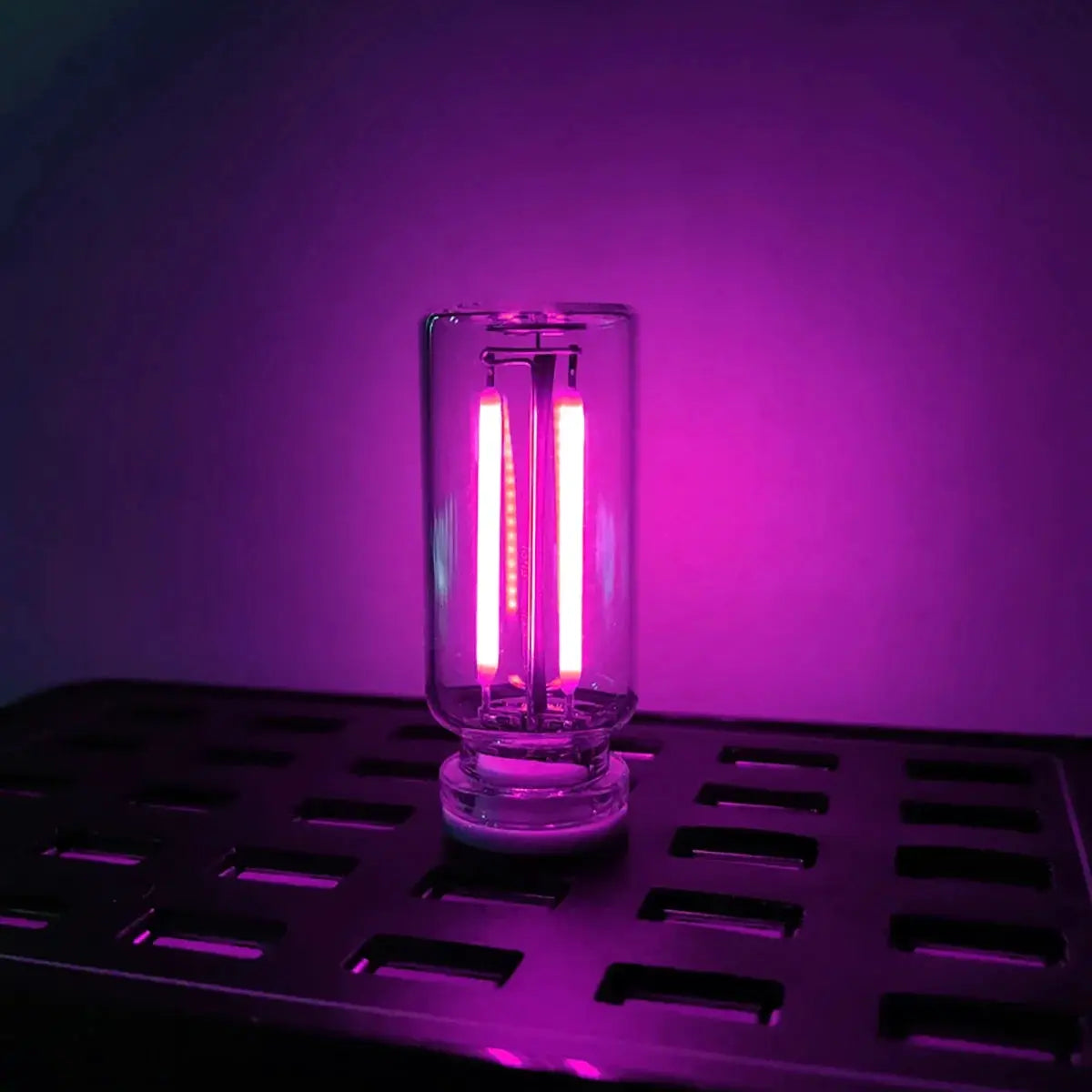 Portable USB touch night light with pink LED filament in clear glass bulb by Simples Market for car, bedroom or camping