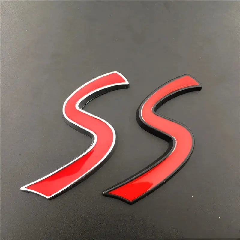 Two 3D red S car grille emblems, metal badge stickers