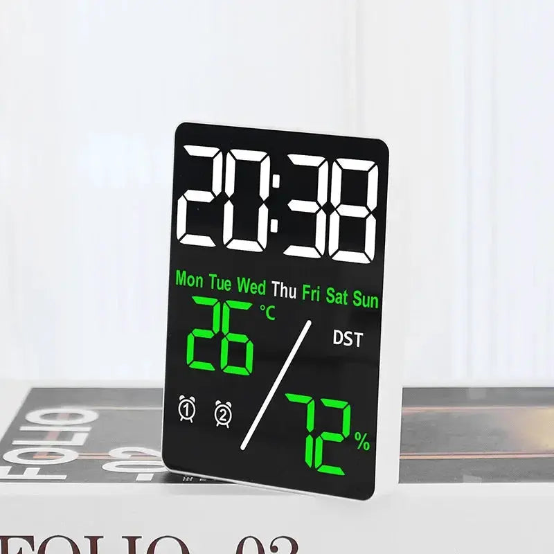 Multifunctional large-screen desk alarm clock with humidity display, black panel and bright green readouts.