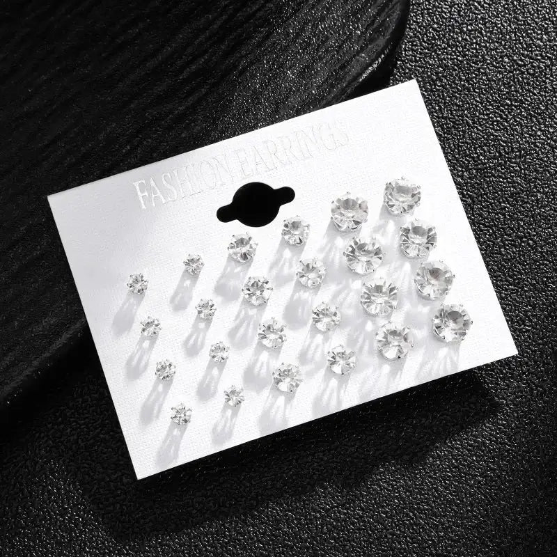 White crystal stud earrings set, 12 pairs, displayed on a white card