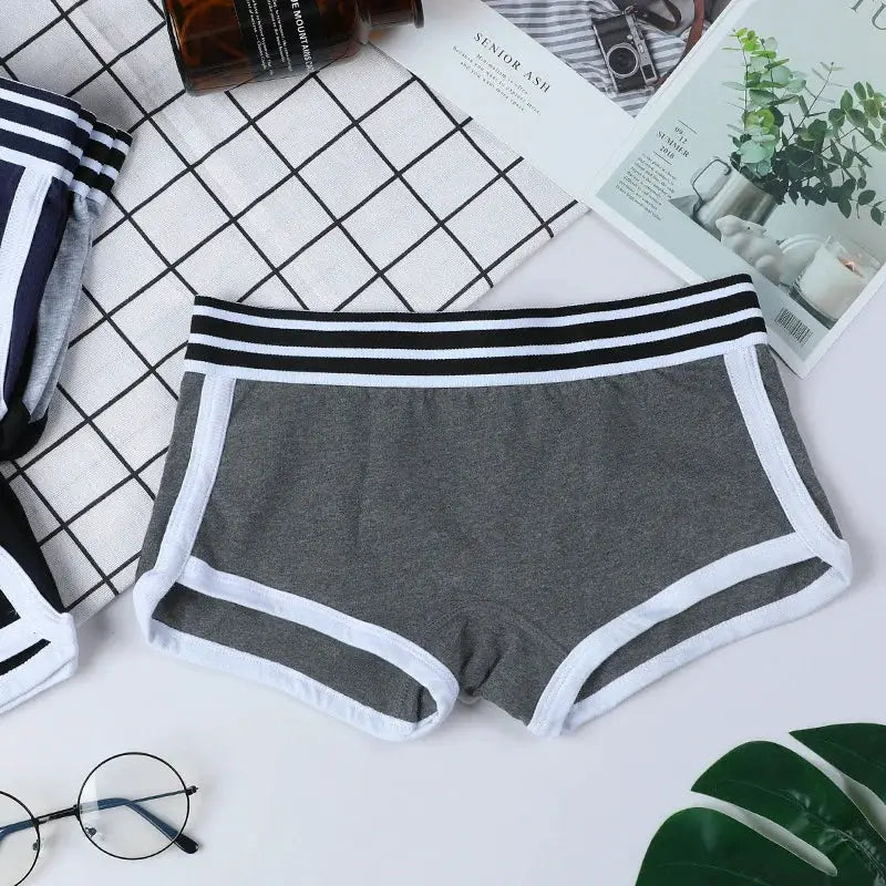Women's low-waist boxer shorts in gray with white trim and black-and-white striped waistband