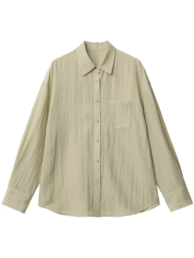 Women's beige long-sleeve shirt, solid color, loose-fit with front button-down and chest pocket.