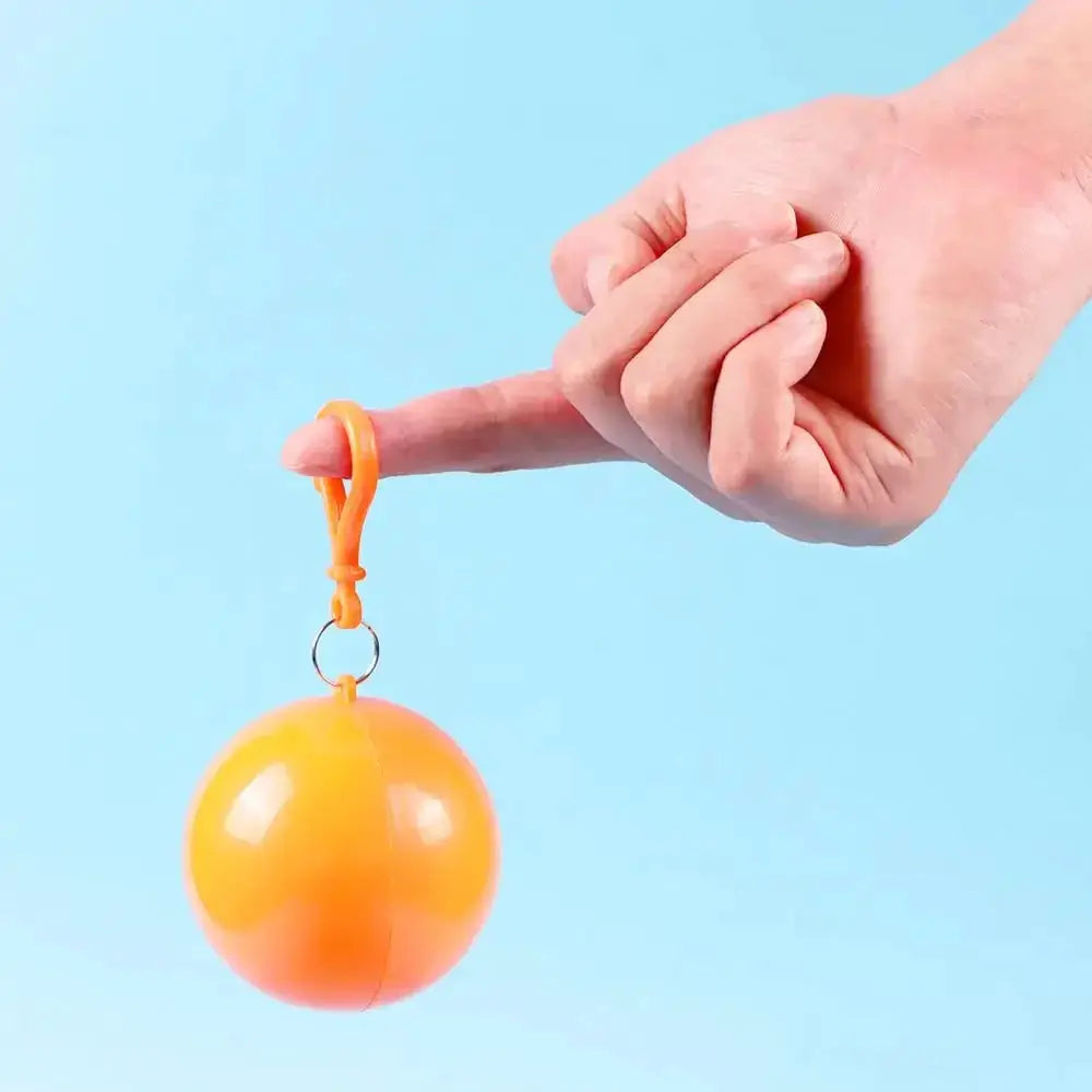 Simples Market portable disposable raincoat keychain compression ball in orange with clip