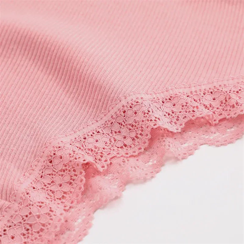 Pink cotton panties with floral lace trim; close-up of soft ribbed fabric and scalloped lace edge, Simples Market