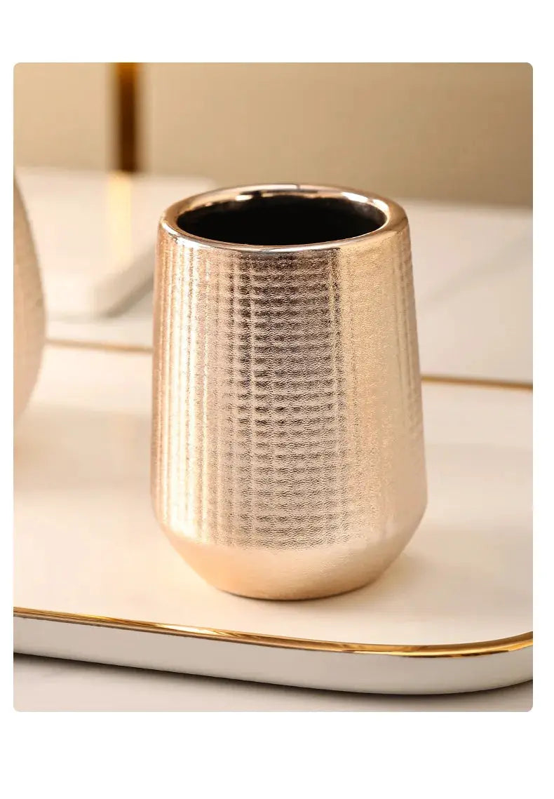 Rose gold ceramic bathroom cup/holder with textured finish