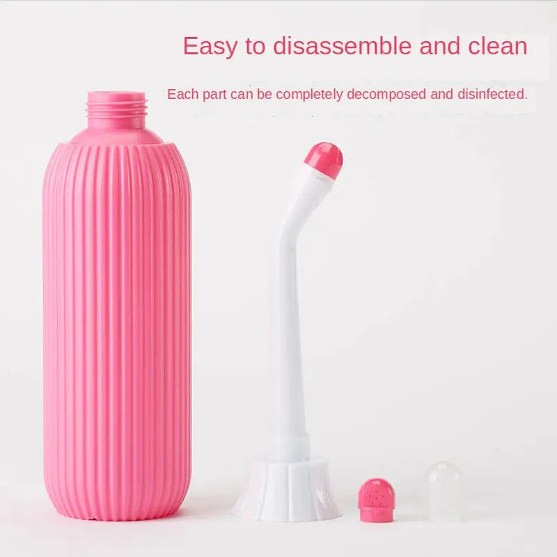 Simples Market portable bidet set: pink ribbed bottle with white curved nozzle and pink tip, plus pink and clear caps