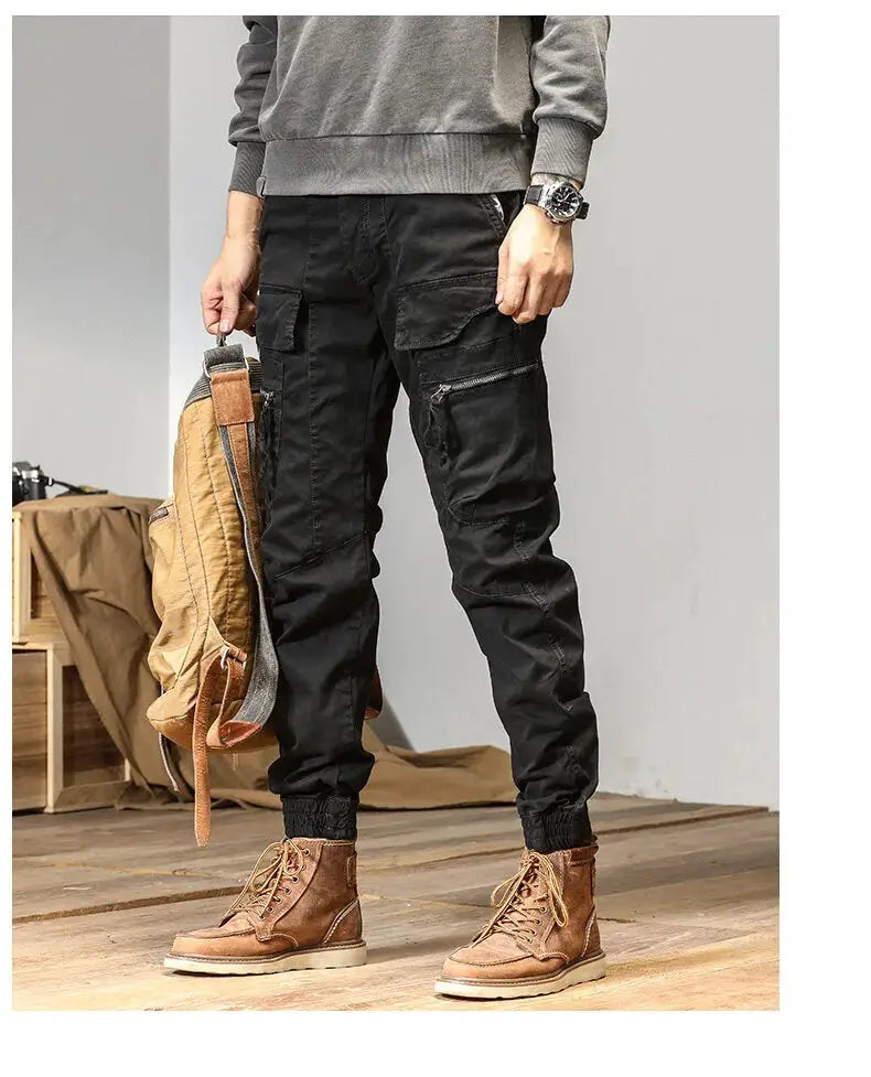 CAAYU cargo joggers for men; black multi-pocket pants with zip pockets and cuffed ankles