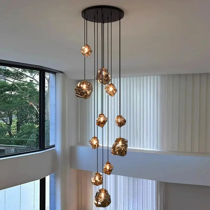 LED pendant light with multiple hanging crystal glass globes in warm amber glow for modern living room decor