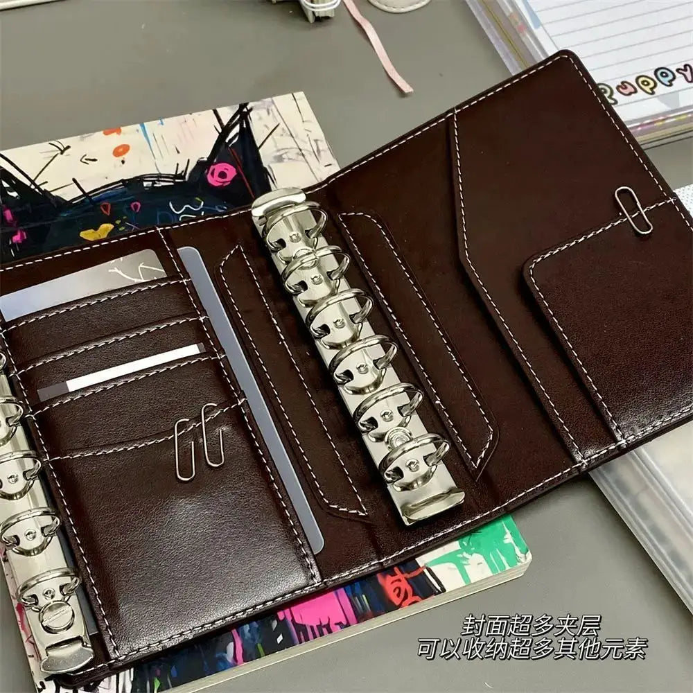 Two dark brown faux leather A7 binders with silver rings, card slots and pockets, Simples Market 80-page planner set