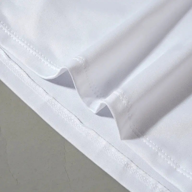 White men's sports compression vest undershirt with hem stitching detail.