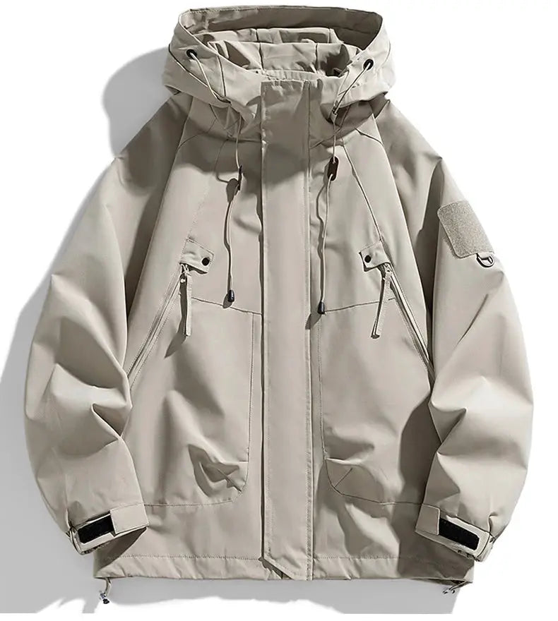 Men's khaki waterproof softshell hooded windbreaker jacket with zippered pockets and cargo pockets
