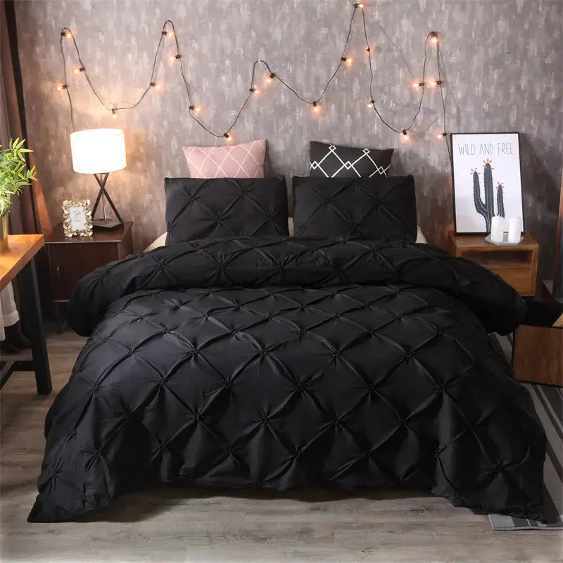 Queen Comfort Set 3-Piece by Simples Market, gray quilted duvet cover with pillowcases on a bed