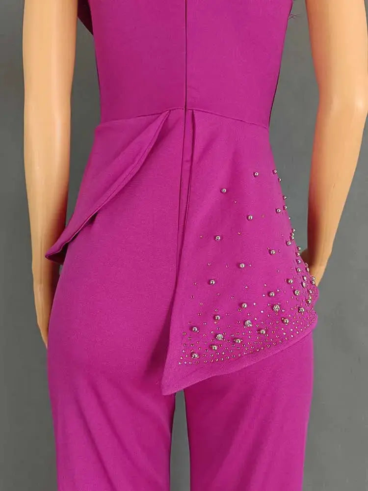 High-waist pink strapless jumpsuit with rhinestone-embellished draped panel