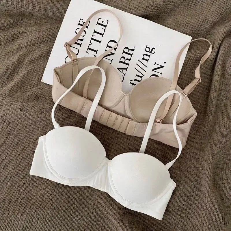 Women's seamless half-cup push-up bras by Simples Market in white and nude beige; non-wire back closures, 2-hook, set of 2