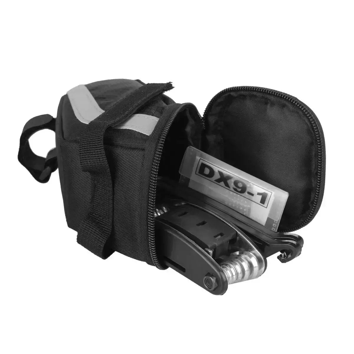 B SOUL cycling saddle bag opened, displaying repair tools and accessories for cycling adventures.