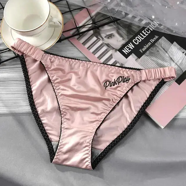 Girls satin pink panties with PinkPlay embroidery and black trim, elastic waistband