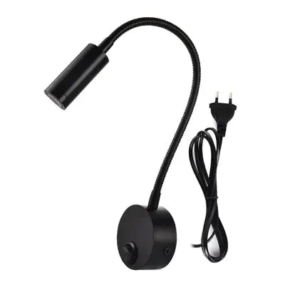 Simples Market LED flexible gooseneck wall lamp, black with round base and plug-in power cord.