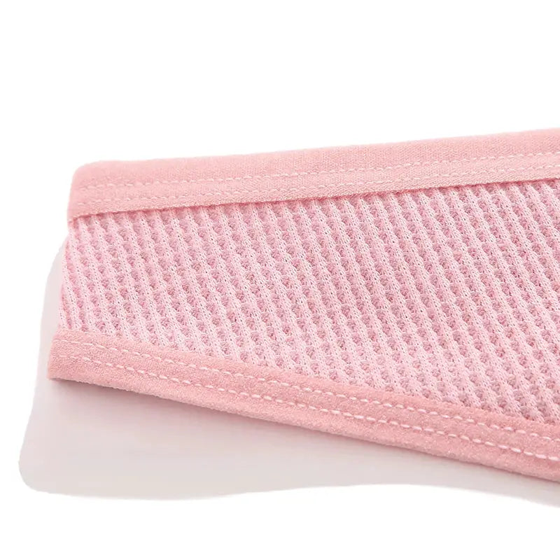 Pink waffle cotton women's panties close-up showing textured knit fabric and soft elastic waistband.