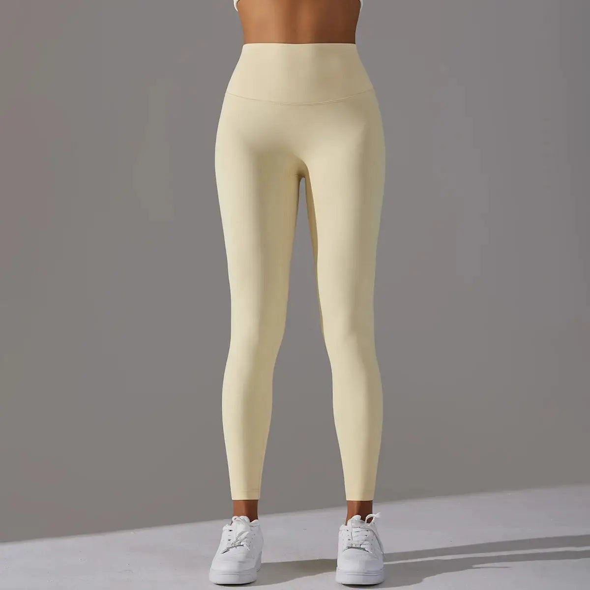 Beige high-waisted leggings for fitness and yoga; slim, form-fitting athletic pants