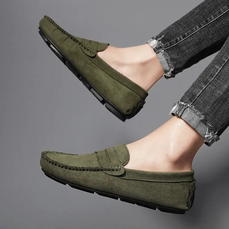 Olive suede men's slip-on driving loafers with moccasin stitching and black rubber sole