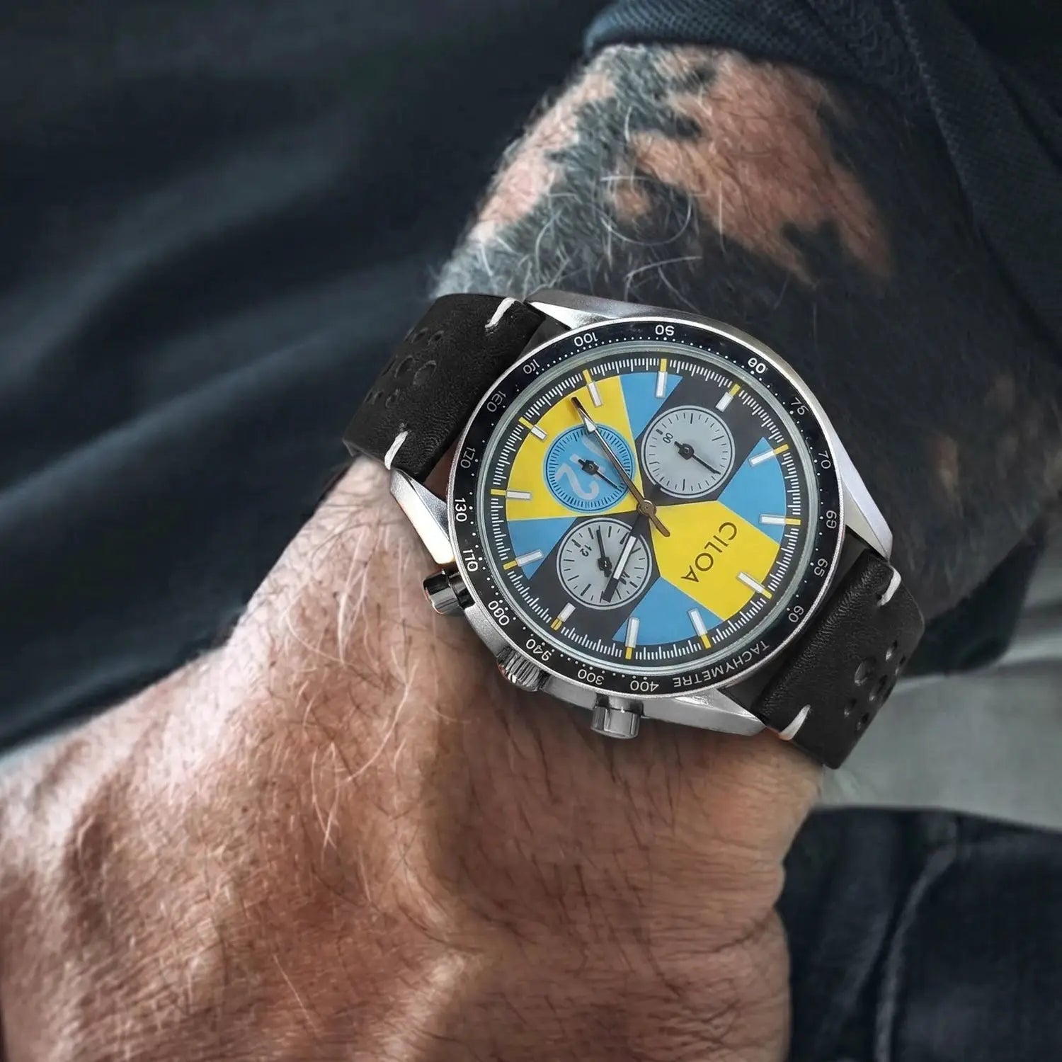 CILOA men's racing chronograph watch with blue and yellow dial and black perforated leather strap