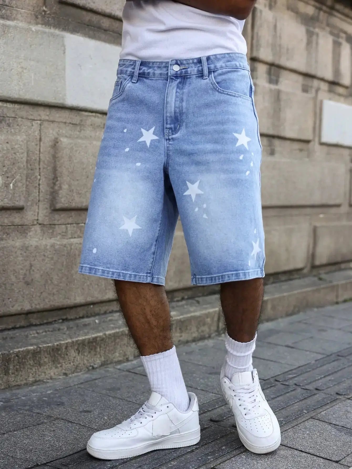 Men's blue denim shorts with white star prints on legs for casual spring/summer wear