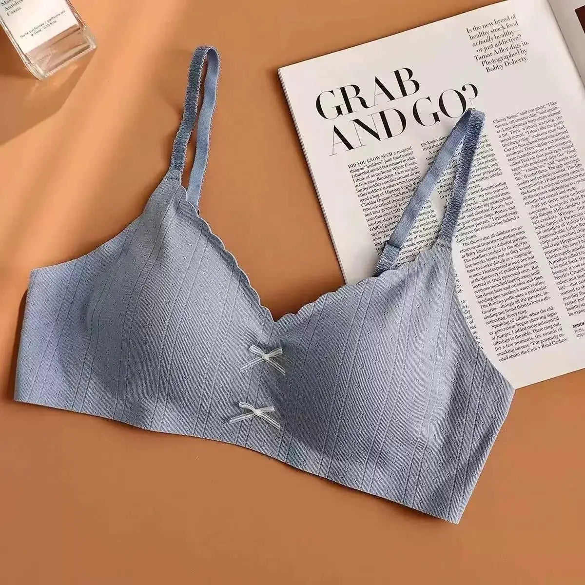 Simples Market women's blue gathered sports bra with breathable fabric, scalloped neckline, and thin double straps