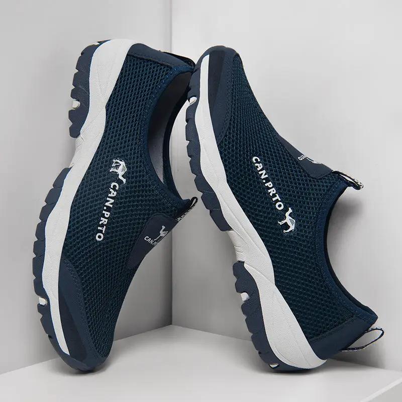 Pair of navy blue breathable mesh slip-on men's sneakers with white sole and rugged outsole