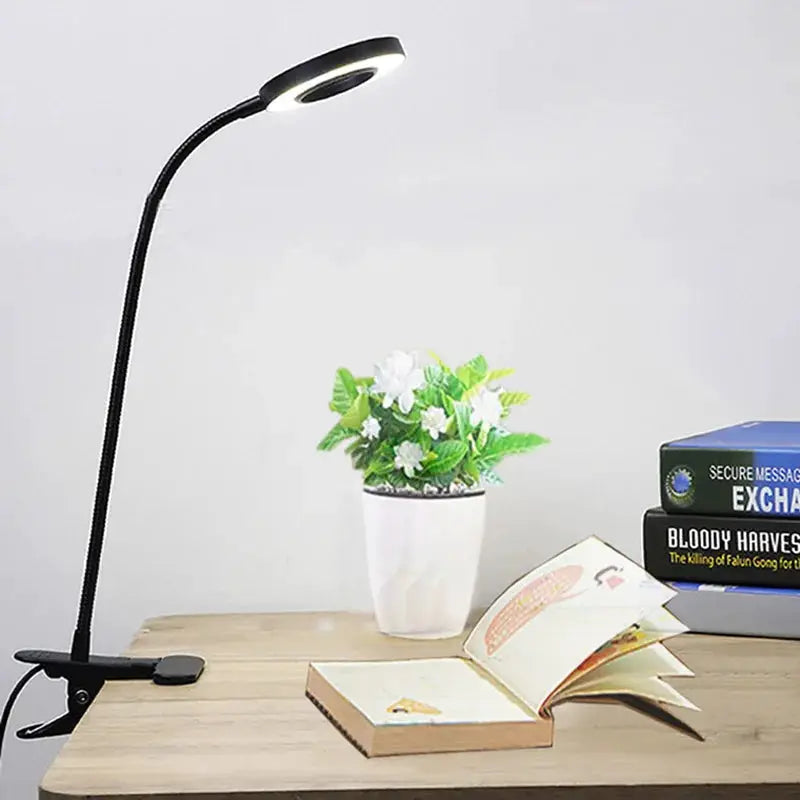Simples Market LED ring clamp lamp, black USB desk light with 360° gooseneck; 3-level color temp; plant and 3 books