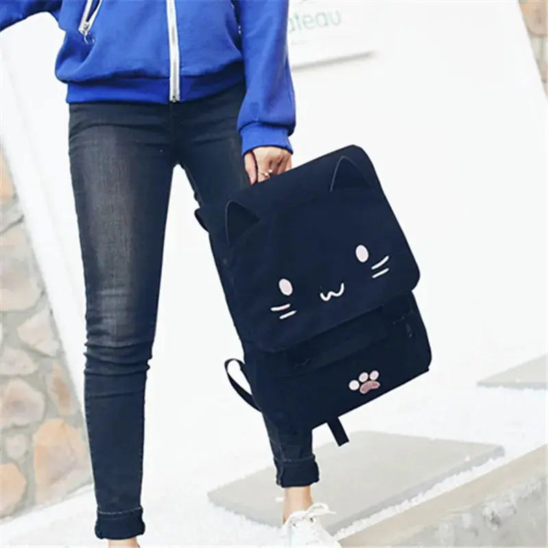 Japanese Stupid Cute 3D Cat backpack, black with cat-face design, ears, and paw-print pocket