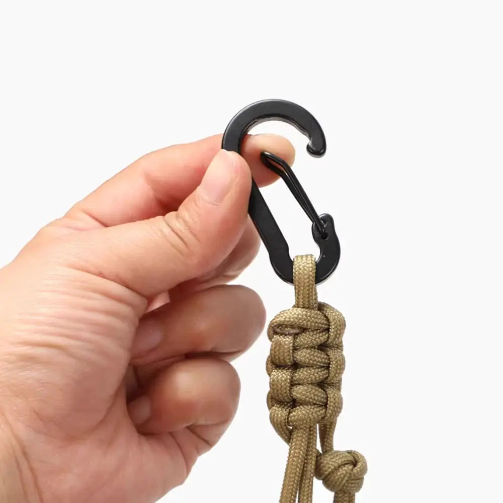 Outdoor multifunctional water bottle buckle keychain by Simples Market with black carabiner and tan paracord.