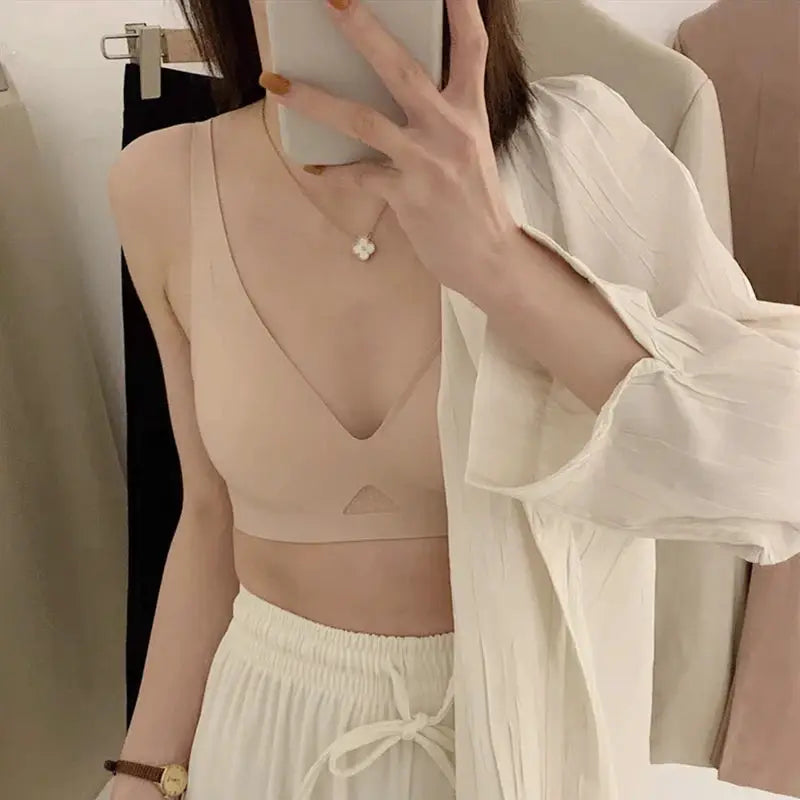 Simples Market wire-free bralette in nude/beige, seamless lingerie for women, shown with a white robe.
