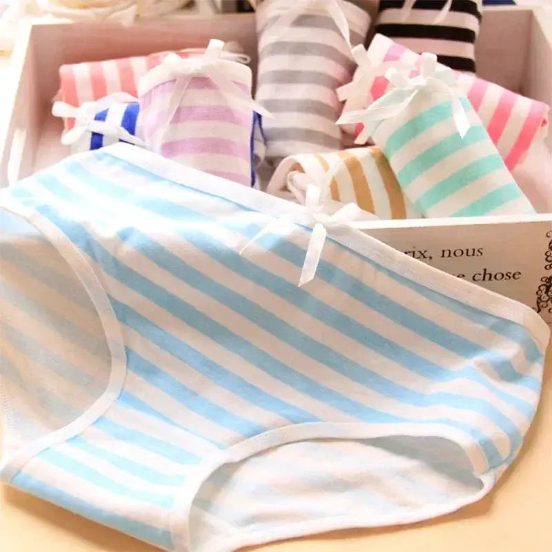 Blue striped panties with white bow; pastel striped girls’ underwear set in a gift box