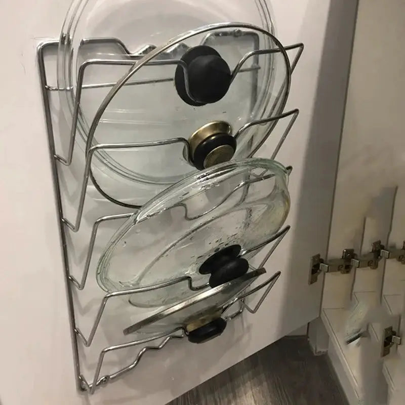 Pot lid storage rack; wall-mounted five-layer chrome metal rack for lids with glass lids shown.