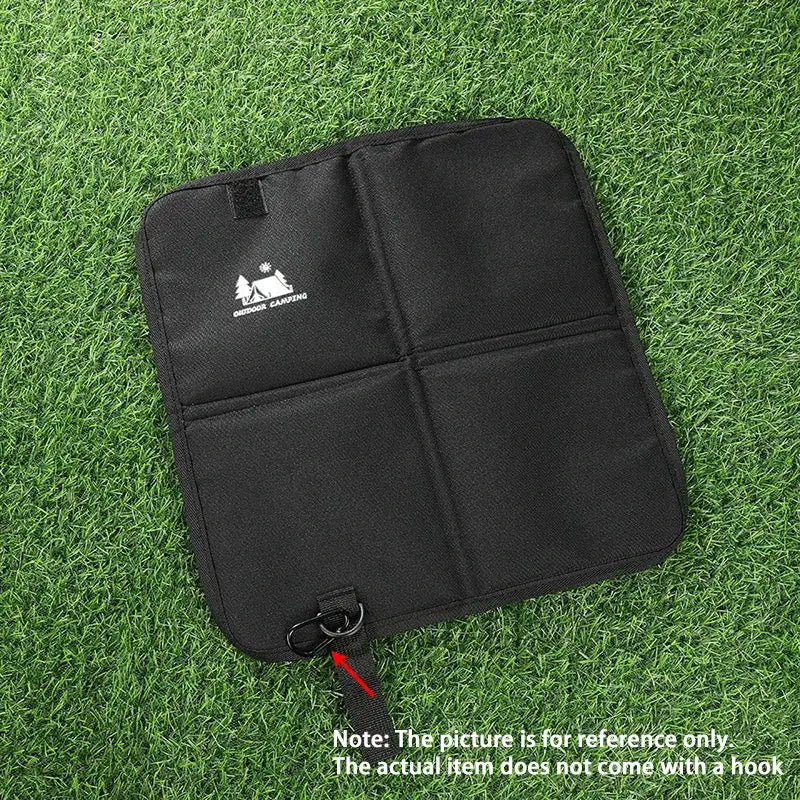 Outdoor camping foldable seat cushion by Simples Market, black moisture-proof mat with strap and metal ring.