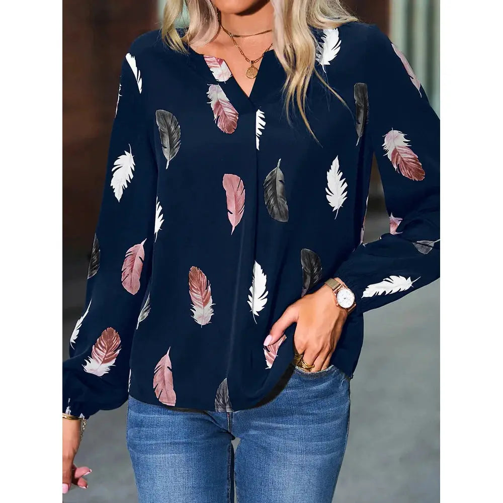 Women's navy feather-print chiffon blouse with long sleeves.