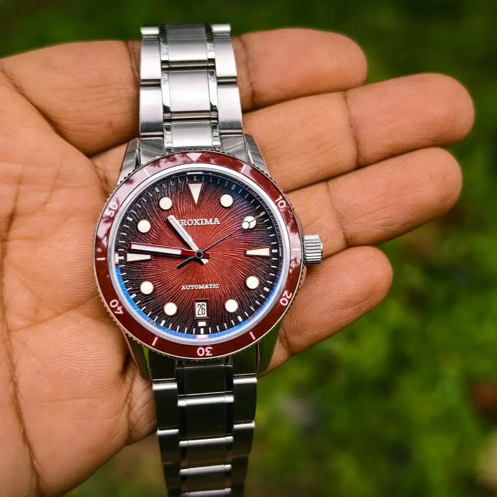 Proxima 39mm dive watch with red sunburst dial, luminous markers, stainless steel bracelet, automatic movement, 100m WR