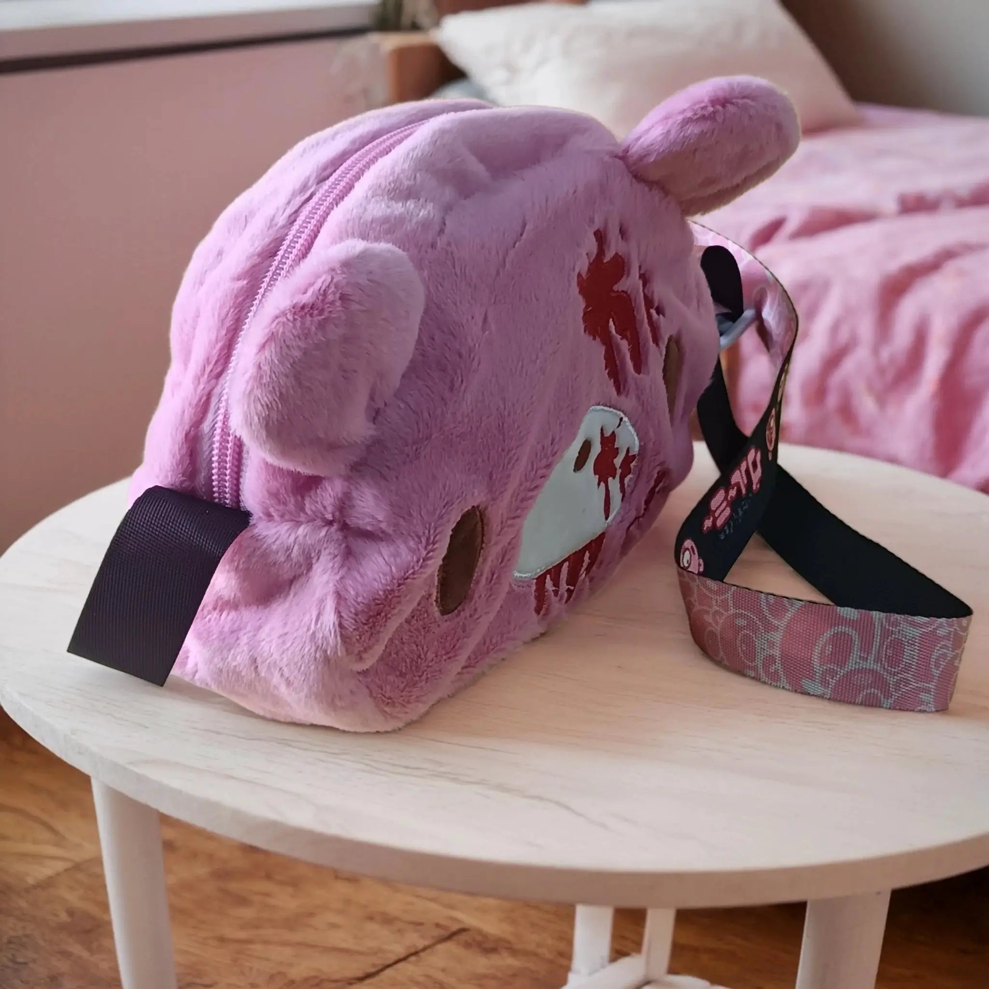 Gloomy Bear plush crossbody bag in pink with blood-splatter detailing; by Simples Market.
